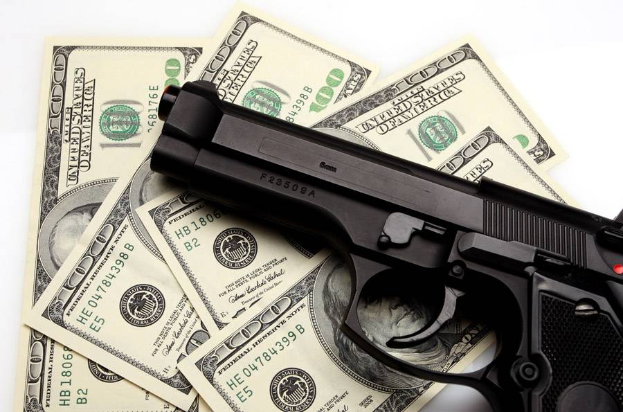 pistol and dollar
